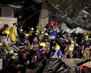 Oklahoma National Guard soldiers and rescue workers dig through the rubble of Plaza Tower Elementary school May 21 after a devastating tornado ripped through Moore, Okla., the previous day. The tornado touched down outside Oklahoma City leaving a 20-mile path of death and destruction. (CNS photo/Sgt. 1st Class Kendall James, Oklahoma National Guard handout via Reuters) 