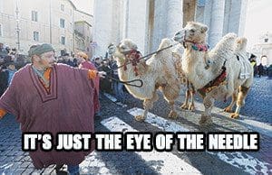 A man in traditional attire guiding camels during a traditional parade marking the feast of the Epiphany in St. Peter’s Square at the Vatican on Jan. 6. (CNS photo/Paul Haring)