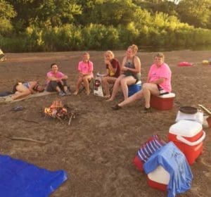 Mothers and daughters, members of St. Francis Borgia Parish, Cedarburg, pose for a photo near the Wisconsin River during their Aug. 12-14 Paddle and a Prayer retreat. Top, participants left their mark along the riverbank by inscribing the words, “Paddle and Prayer,” in the sand. (Submitted photos courtesy Tracy Dereszynski)